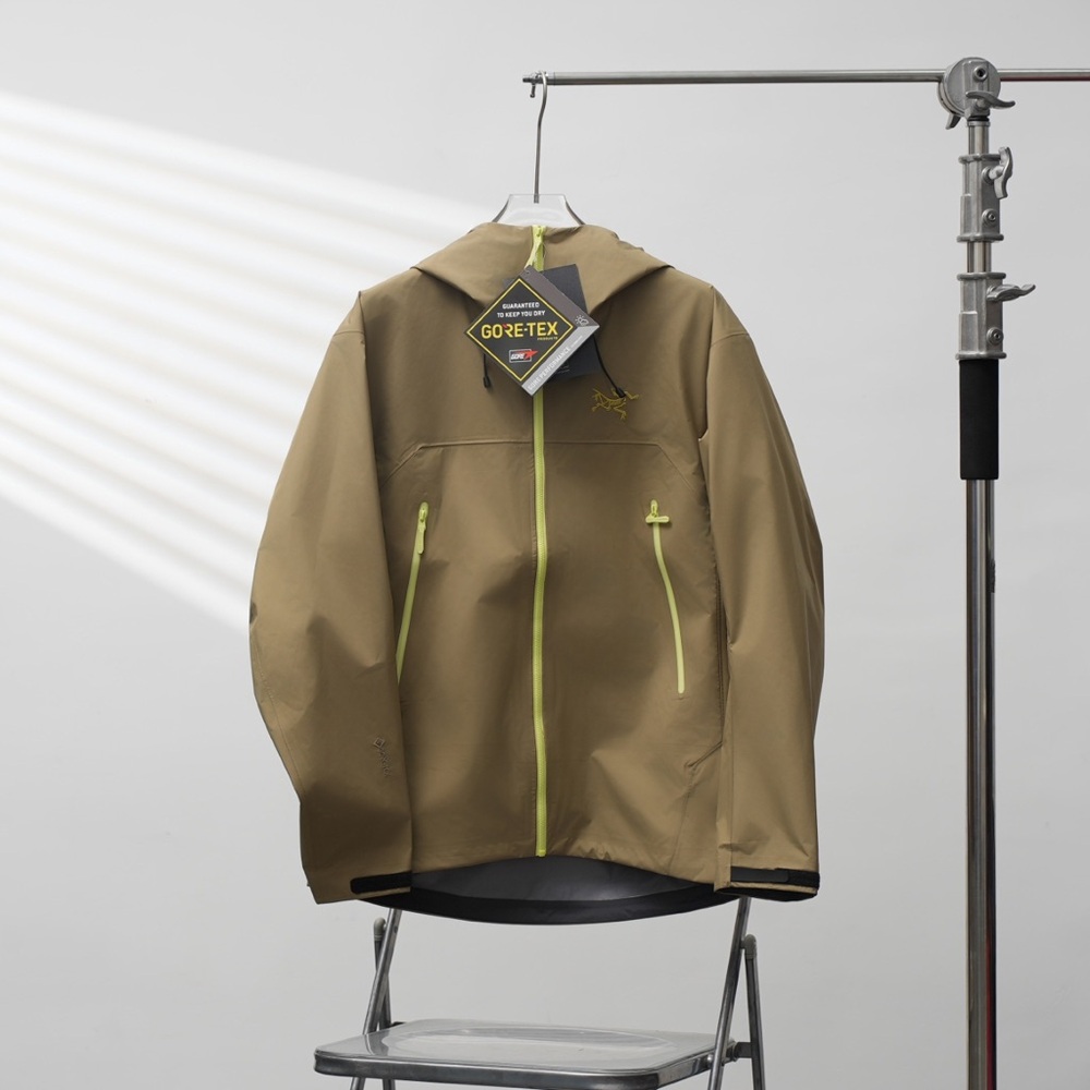 Arc'teryx Men's Tan Raincoat with Yellow Accents